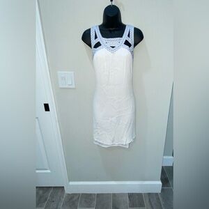 White dress with blue stitched neckline